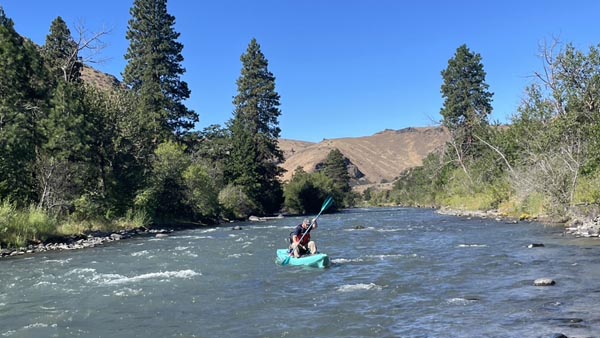 Kayaks are used to map the water depth upstream of measurements used to estimate ecosystem respiration. (Image credit: Morgan Barnes, PNNL)