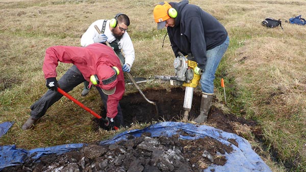 Opening a pit to observe and sample the soil profile of a low-centered ice-wedge polygon on the Arctic Coastal Plain of Alaska. (Image credit: Julie Jastrow, ANL)